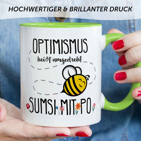 Bedruckte Tasse mit Spruch - Optimismus heißt umgedreht Sumsi mit Po