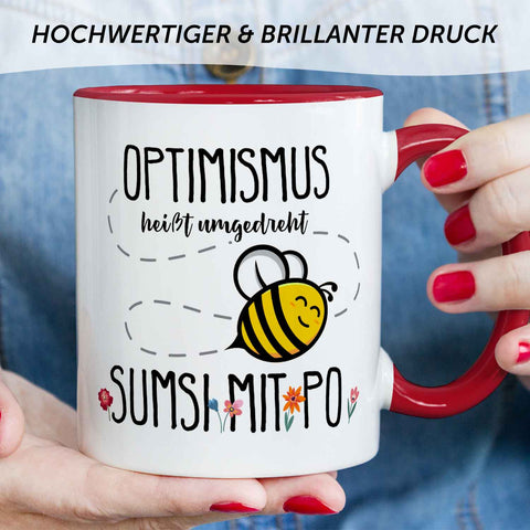 Bedruckte Tasse mit Spruch - Optimismus heißt umgedreht Sumsi mit Po